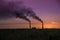 Industrial smoke from chimney at sunset, steppe near Almaty, Kazakhstan