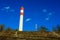 Industrial smoke stack and telecommunication mast on a hill