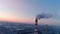 Industrial smoking pipe at plant aerial background