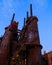 Industrial steel stacks rusted and colorful over time in Bethlehem Pa on a summer day.
