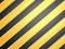 Industrial striped road warning yellow-black background