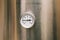 An industrial thermometer is mounted on a stainless steel boiler. Heated cold water. Temperature sensor. Components of heating