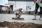 Industrial tools - helicopter concrete floor, screed  finishing. Construction worker finishing concrete screed with power trowel
