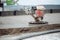 Industrial tools - helicopter concrete screed  finishing. Construction worker finishing concrete screed with power trowel machine