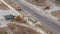 Industrial truck loader excavator moving ground and loading into a dumper truck timelapse