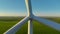 Industrial turbine tower creating green renewable power in slow motion.