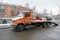 Industrial vehicles. Car tow truck covered with snow