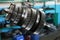 Industrial vertical gearbox. Large gears of a truck. Engine and gear shaft disassembled