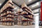 Industrial warehouse, shelving with boxes. Generative AI