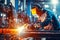 Industrial welder worker is welding in factory close-up