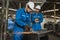 Industrial worker cutting metal and steel with many sparks