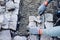 Industrial worker installing pavement rocks, cobblestone blocks