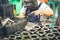 Industrial worker in manufacturing plant grinding to finish a Metal pipe