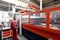 Industrial worker operates a laser cutting machine - employee in