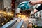 Industrial worker using a compound mitre saw with circular blade