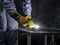 Industrial worker wearing safety mask, helmet, and safe glasses welding metal construction on factory. Industrial mechanic