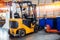 Industrial yellow forklift in warehouse Logistics store