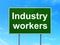 Industry concept: Industry Workers on road sign background