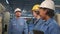 Industry engineer teams inspect machine control panels in manufacturing factory.