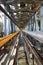 Industry highway walkway platform with grate and handrail on petrochemical plant factory with yellow tubes and fire