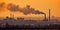 Industry metallurgical pipe with heavy black smoke causing air pollution. Sunset AI generative illustration