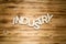 INDUSTRY word made of wooden letters on wooden board