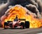 The Indy 500 race car is burning with smoke coming from its back.