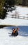 inexperienced young boy trying for the first time the cross-country skiing