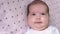 Infancy, childhood, development, medicine and health concept - close-up view from above face of chubby newborn calm