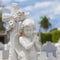 Infant angel with a diffused cemetery background