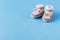 Infant announcement concept with newborn shoes