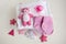 infant baby clothes baby girl pacifier cap on background