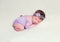 Infant baby girl in lace violet outfit