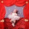 Infant baby girl wearing white ballerina tutu and crocheted ballet slippers