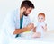 Infant baby receives a nebulizer treatment through the facial mask