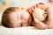 Infant baby sleeping with plush toy