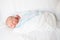 Infant Baby Swaddled in Hospital Blanket