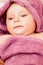 Infant baby in violet towel