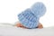 Infant with blue knit hat
