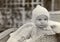 Infant boy in 1923 dressed in warm knit sweater and hat.