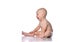 Infant child baby in diaper sitting  looking at something in front of him on copy space and happy laughs on white
