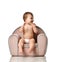 Infant child baby girl kid toddler in diaper sit in little armchair chair