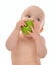 Infant child baby kid eating green apple blue eyes looking at t