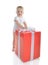 Infant child baby toddler kid with big red present gift for birthday