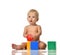 Infant child baby toddler sitting in diaper with green blue brick toy and red ball playing