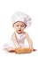 Infant cook baby portrait wearing apron and chef hat with dough rolling pin, isolated on a white background