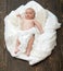 Infant covered with white blanket. Childhood and Divine gift concept.