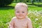 Infant in dandelion yard