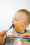 Infant Eating With Spoon Side On