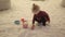 Infant girl playing with bucket in salt room